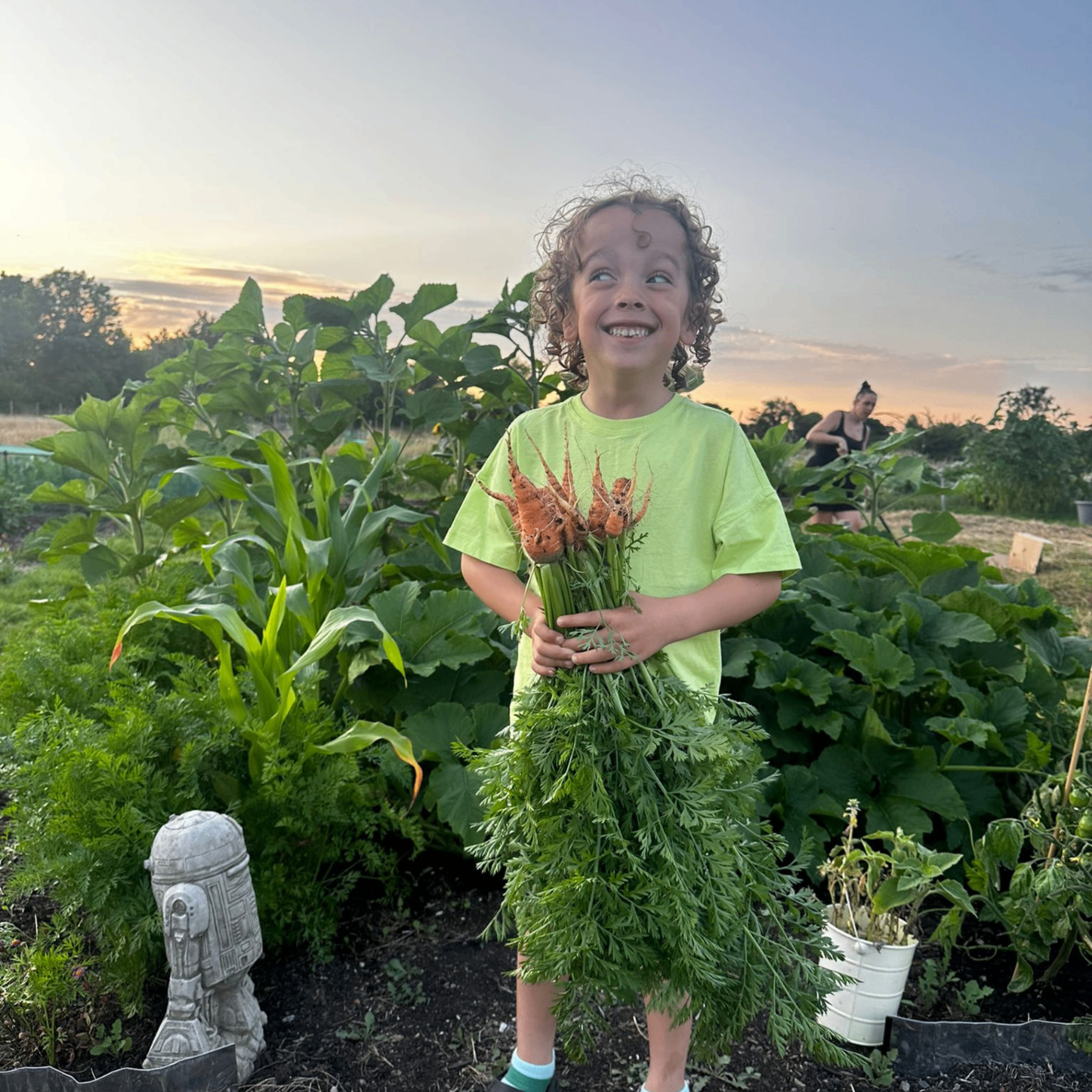 Friends celebrating first harvest at ROOTS allotments